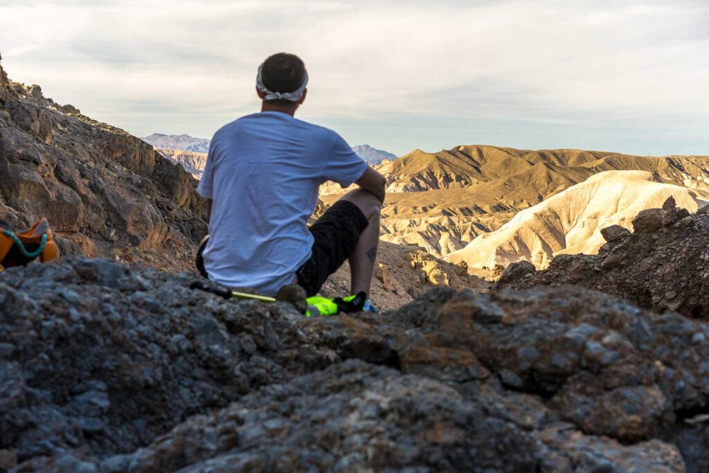 Hiker overlooking badlands