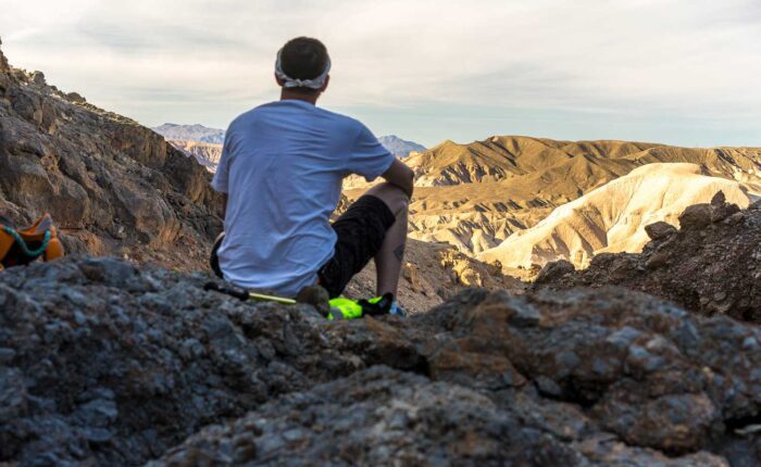 Hiker overlooking badlands