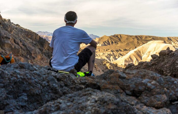 Hiker overlooking badlands